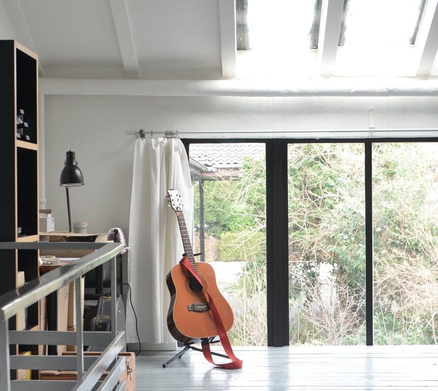 interior of modern apartment with acoustic guitar