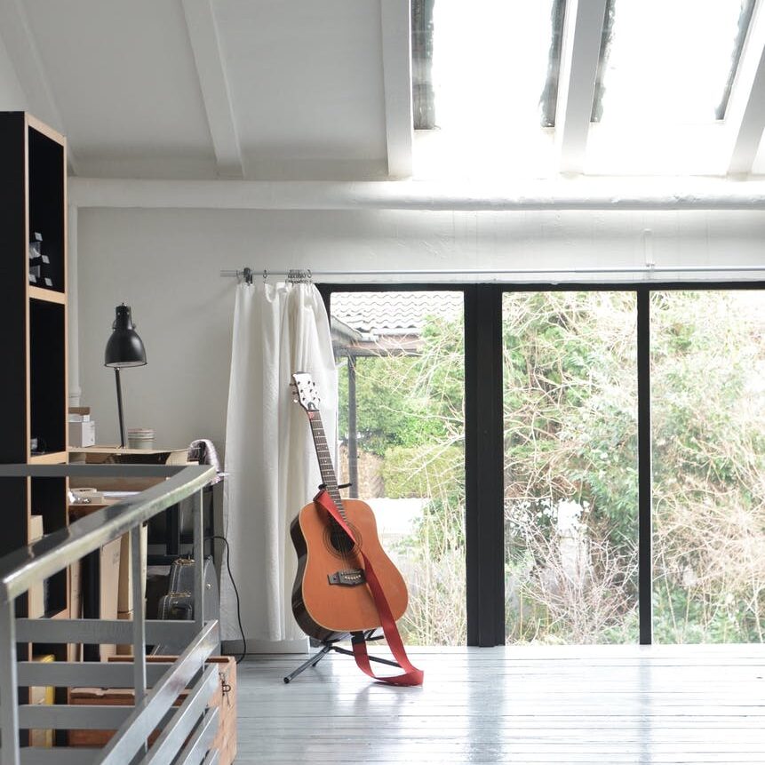 interior of modern apartment with acoustic guitar